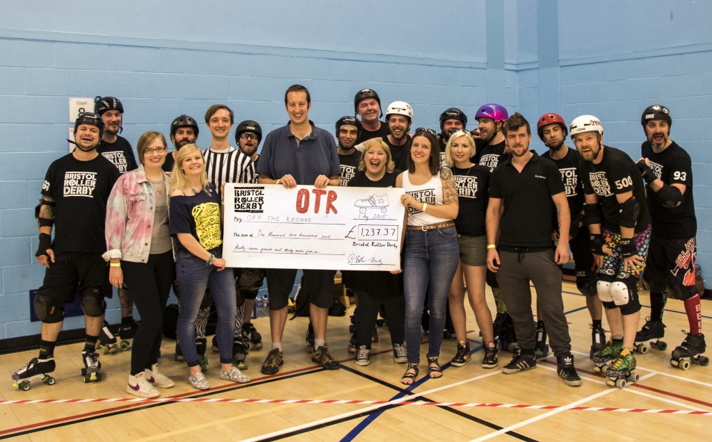 Out of Order cheque giving at UWE sports hall, by BRD to Out of Order. 01.08.15 Taken by Ben Gillett/ Credit - Bengillett.co.uk * Free for BRD and Out of Order to use online to promo the ocassion. Please credit "Photo by bengillett.co.uk"